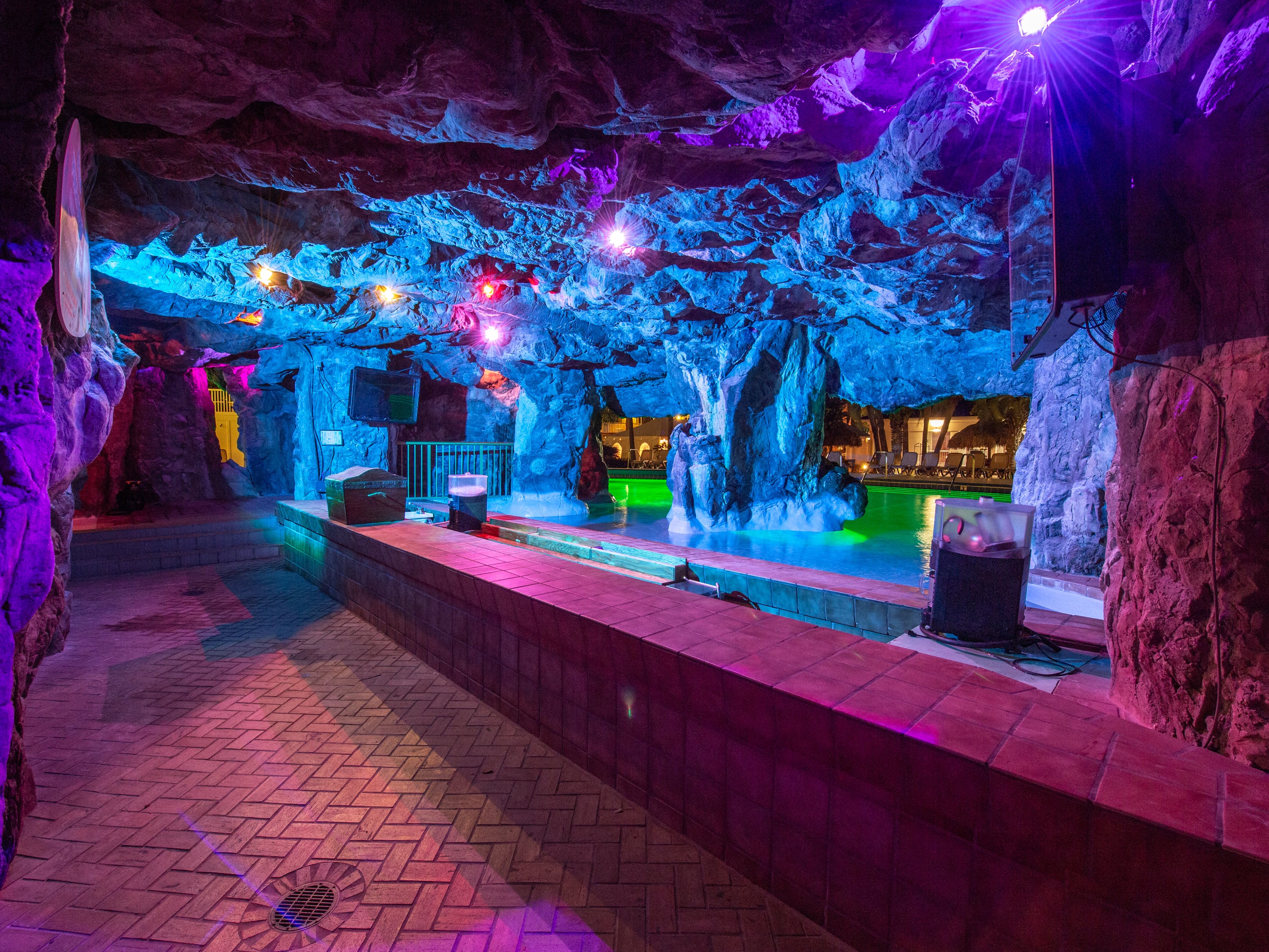 The illuminated Grotto swim-up bar at The Island Resort